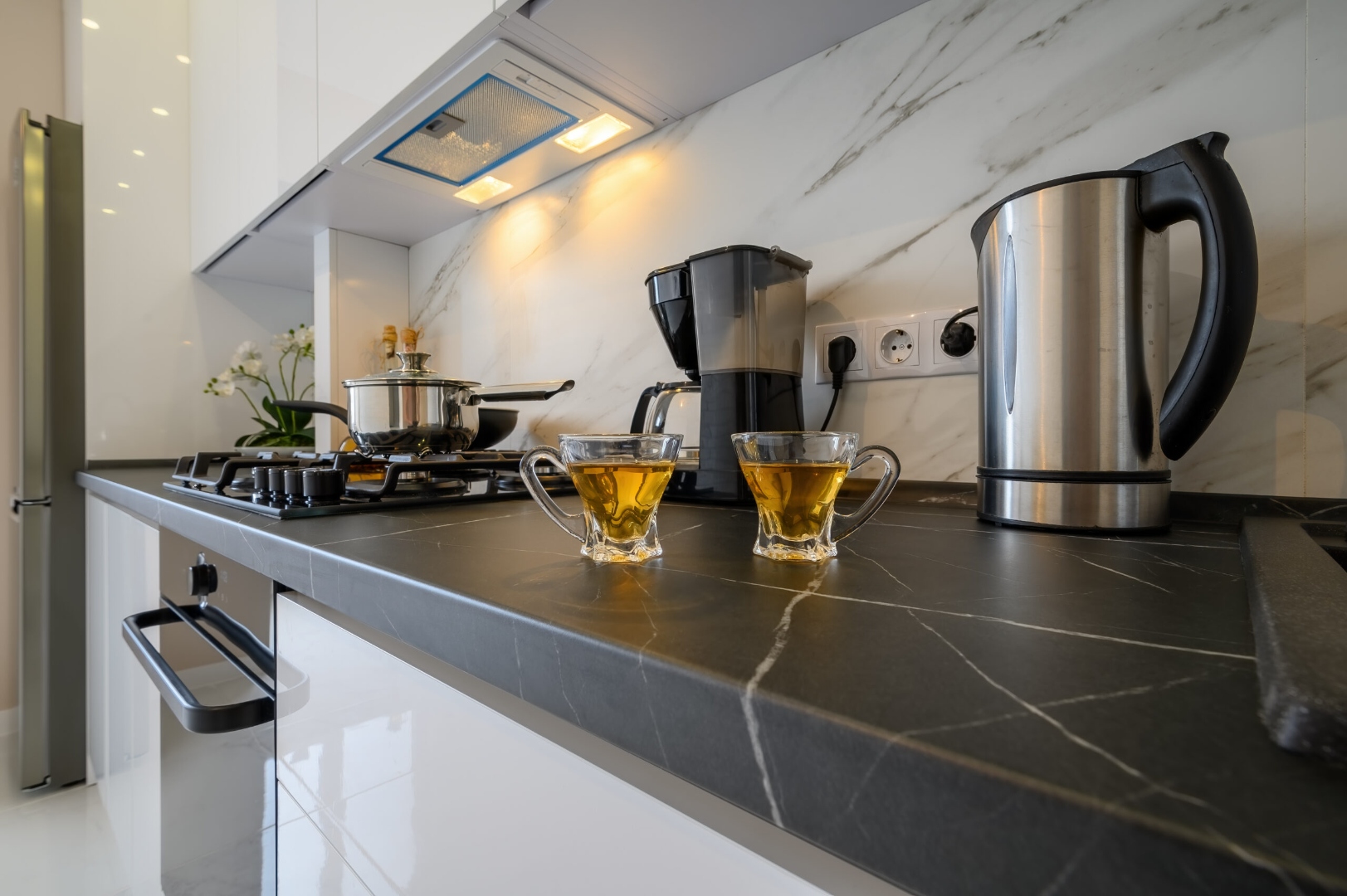Dark quartz countertop close-up with modern cabinetry