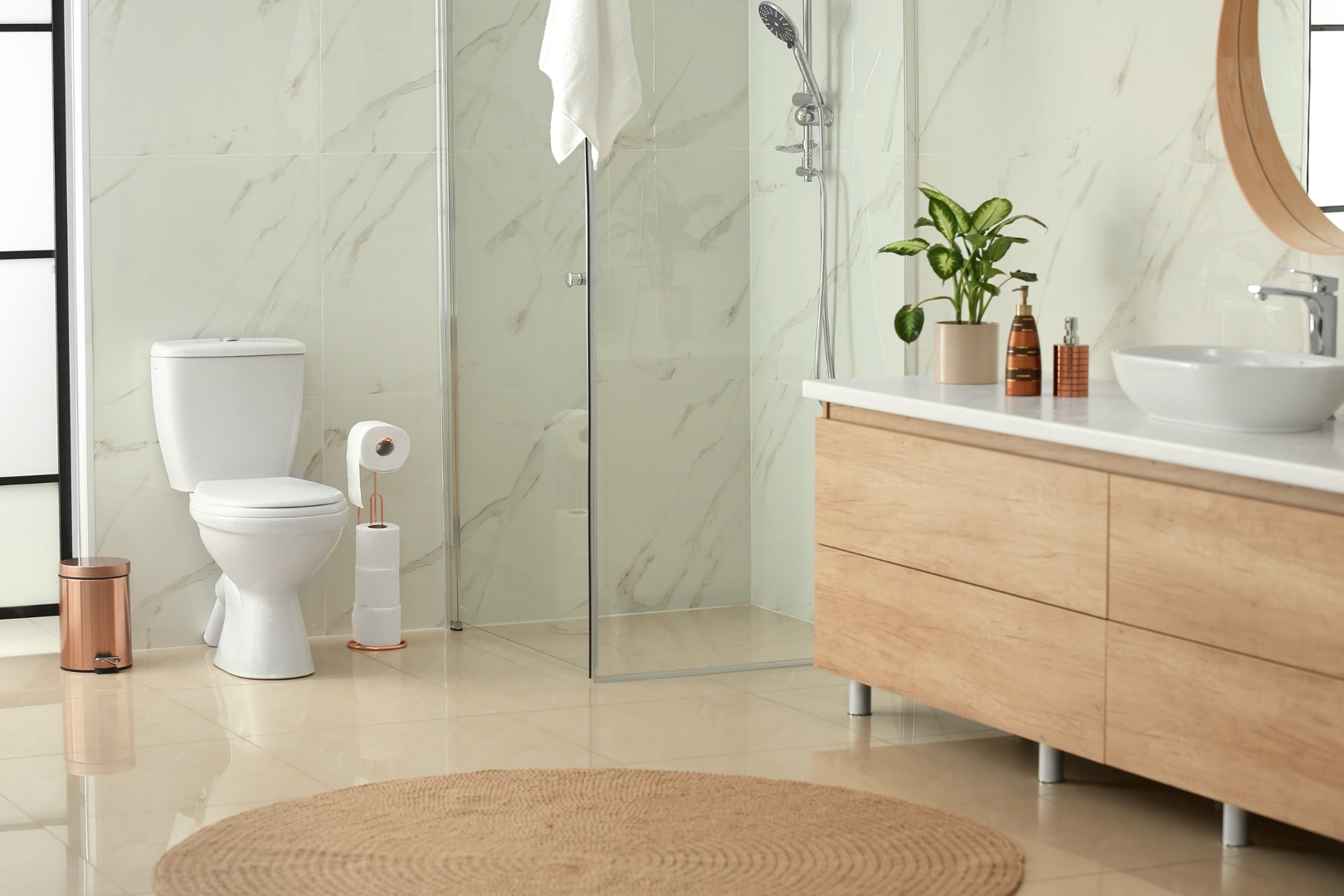 Modern bathroom with marble tile and wood vanity